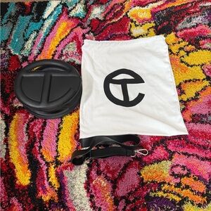 Telfar Black Circle Bag with crossbody strap and White Dust Bag